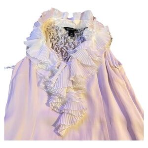 Elegant women’s ruffle top. Light weight and well made. White House black mark